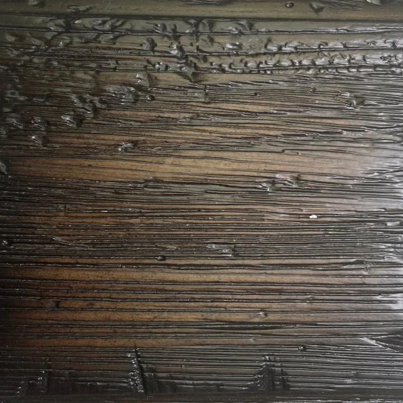 Textured dark wood surface with sheen